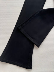 High-waisted embroidered flared pants.