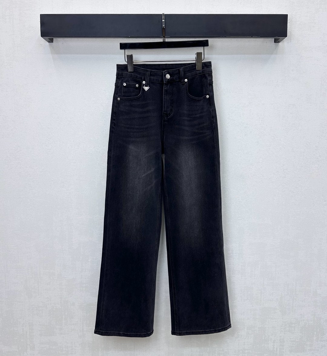 Pleated and distressed denim trousers