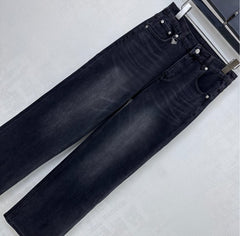Pleated and distressed denim trousers