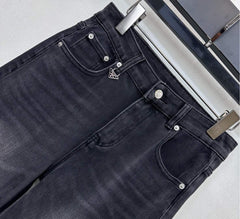 Pleated and distressed denim trousers