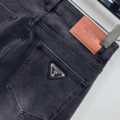 Pleated and distressed denim trousers