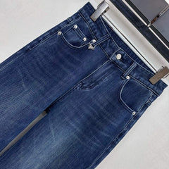 Pleated and distressed denim trousers