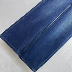 Pleated and distressed denim trousers