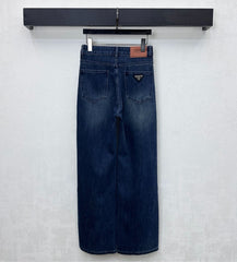Pleated and distressed denim trousers