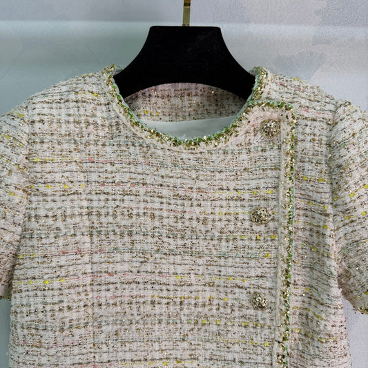 A light beige tweed blend short-sleeved jacket