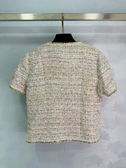 A light beige tweed blend short-sleeved jacket