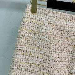 A light beige tweed blend short-sleeved jacket