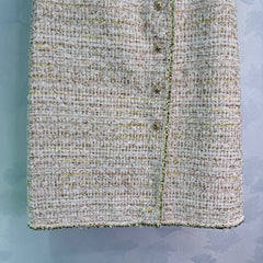 A light beige tweed blend short-sleeved jacket