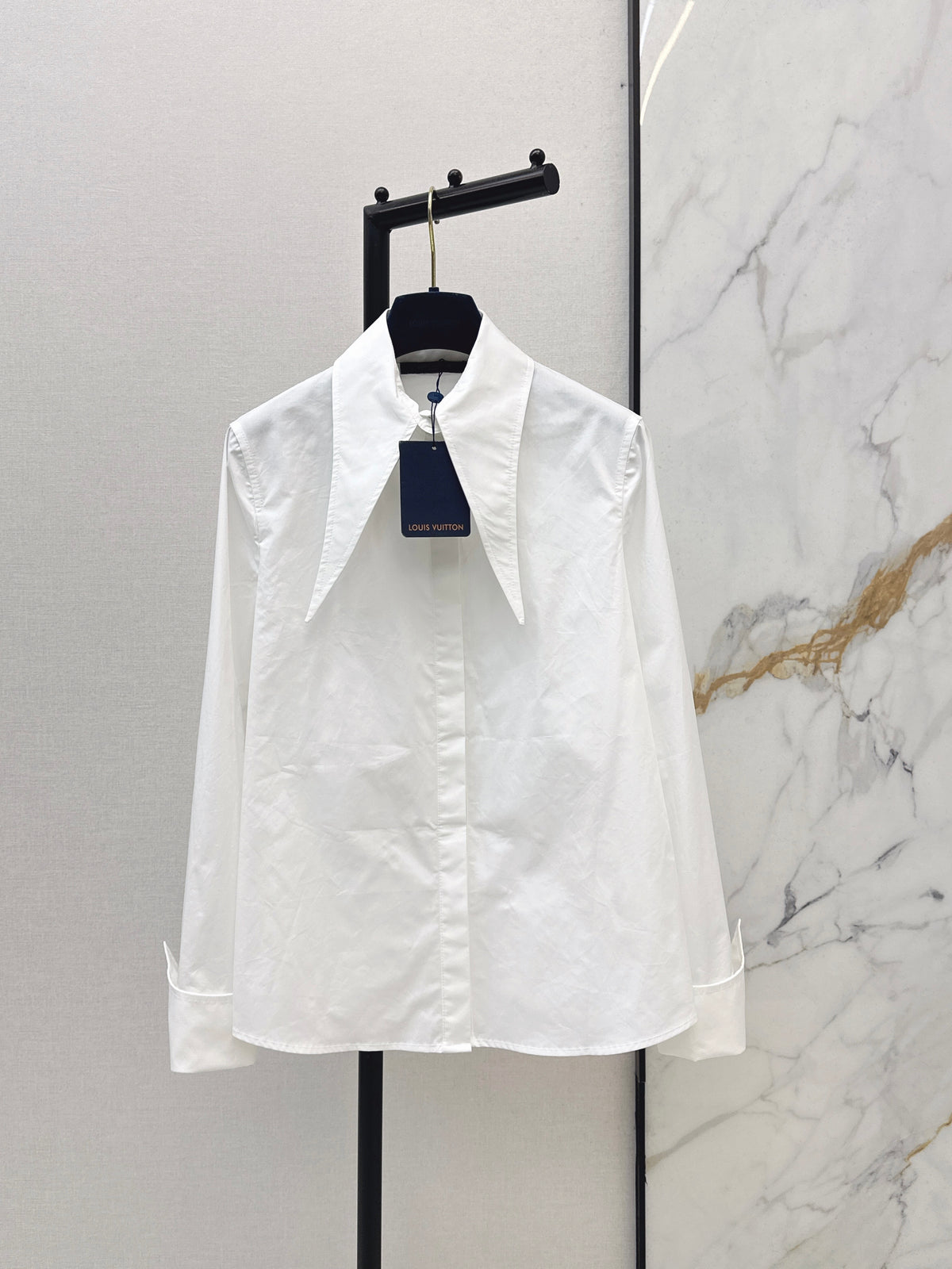 Minimalist white shirt with a long pointed collar
