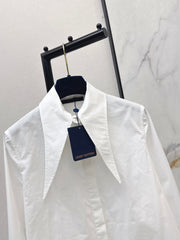 Minimalist white shirt with a long pointed collar
