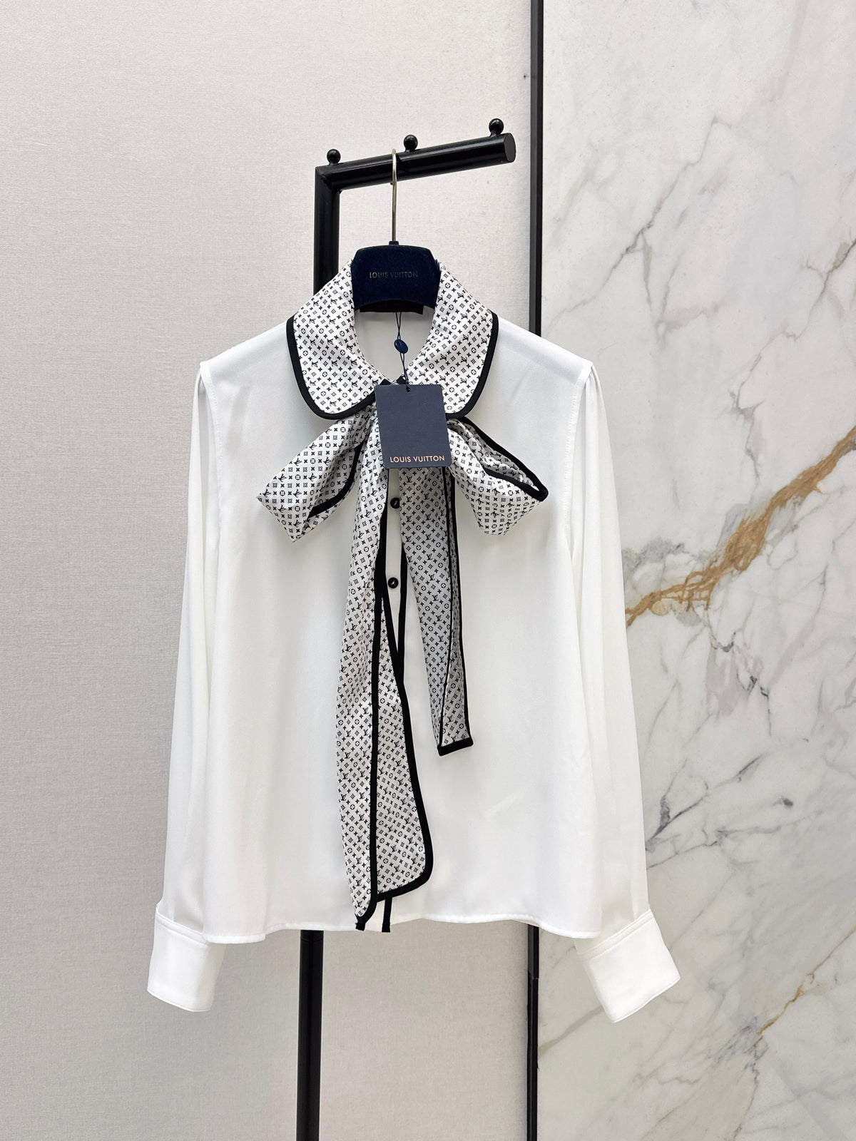 Minimalist white shirt with a long pointed collar