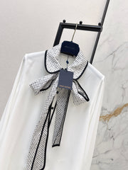 Minimalist white shirt with a long pointed collar