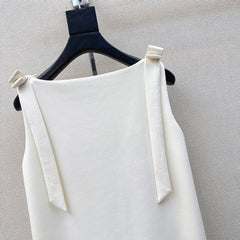 Sleeveless dress with bow-tie shoulder straps