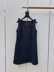 Sleeveless dress with bow-tie shoulder straps
