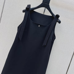 Sleeveless dress with bow-tie shoulder straps