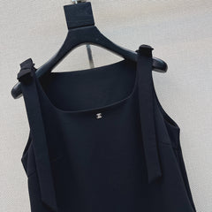 Sleeveless dress with bow-tie shoulder straps