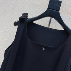 Sleeveless dress with bow-tie shoulder straps