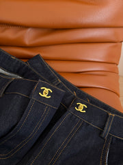 Jeans with a Twist-Lock Metal Buckle Design