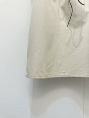 Beige vest dress with contrasting leather label