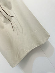 Beige vest dress with contrasting leather label