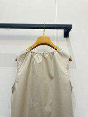 Beige vest dress with contrasting leather label