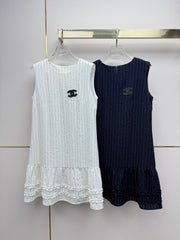 Beige vest dress with contrasting leather label