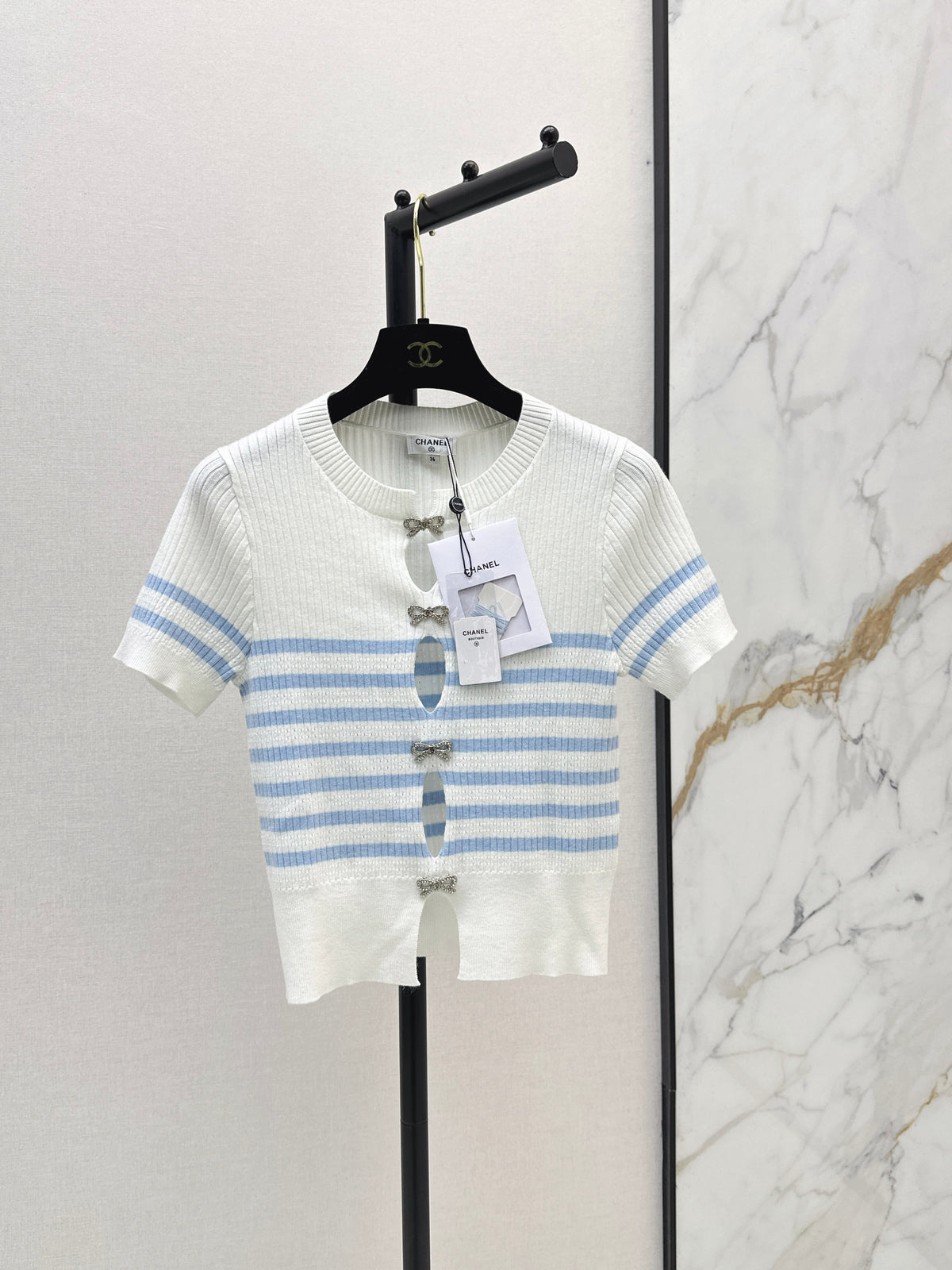 Striped knit top with bow embellishment