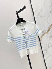 Striped knit top with bow embellishment