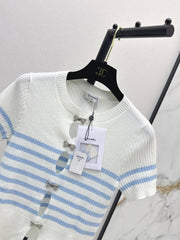 Striped knit top with bow embellishment