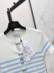 Striped knit top with bow embellishment