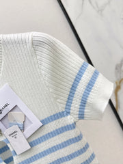 Striped knit top with bow embellishment