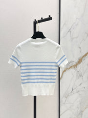 Striped knit top with bow embellishment