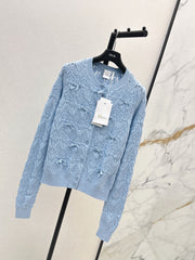 Bow-tie quilted jacquard openwork sweater