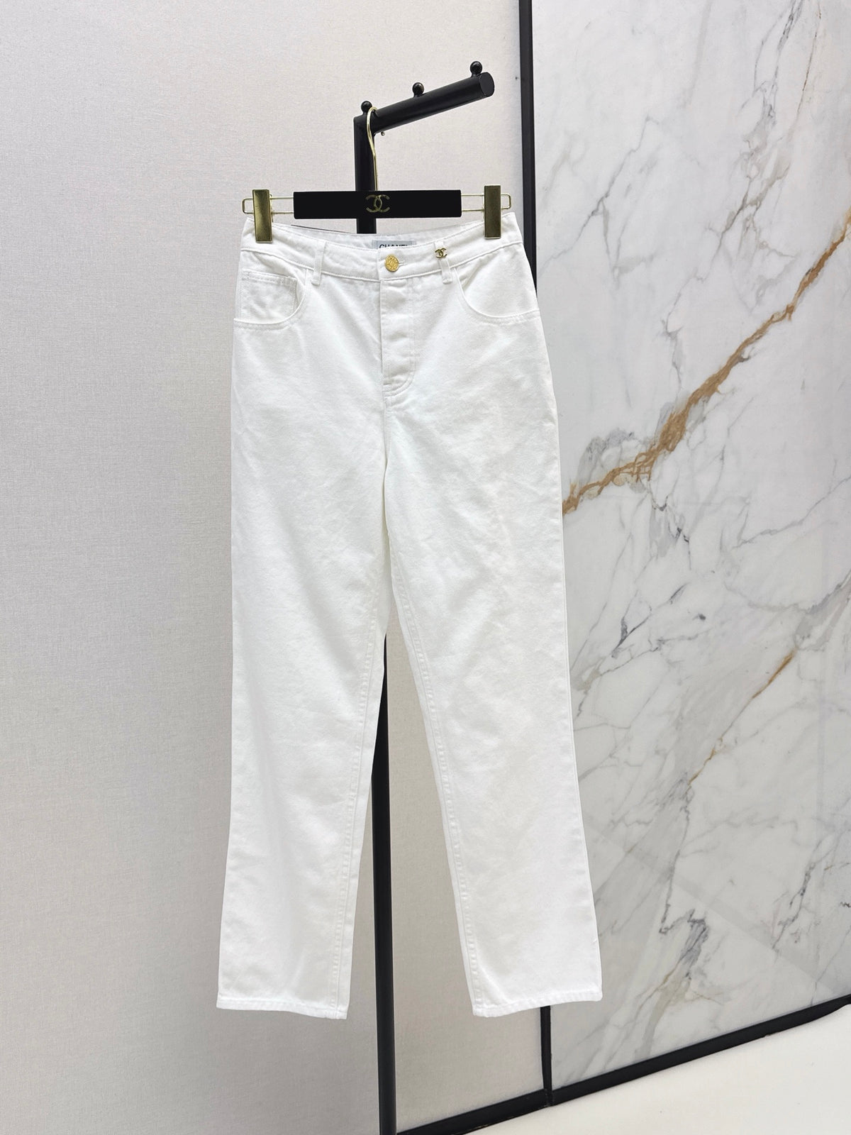 Slim-fit denim trousers with gold buttons