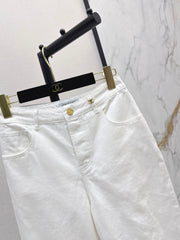 Slim-fit denim trousers with gold buttons