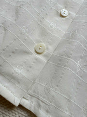 Minimalist French-style sleeveless shirt