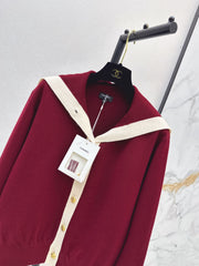 Color-block knit cardigan featuring a nautical-style collar