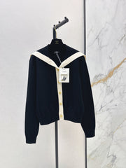 Color-block knit cardigan featuring a nautical-style collar
