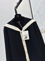 Color-block knit cardigan featuring a nautical-style collar