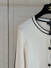 Color-block knit cardigan featuring a nautical-style collar