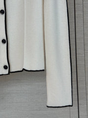 Color-block knit cardigan featuring a nautical-style collar