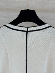 Color-block knit cardigan featuring a nautical-style collar