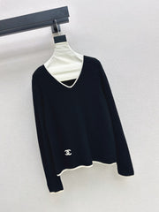 Black-and-white color-block V-neck knit top