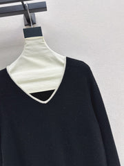 Black-and-white color-block V-neck knit top