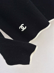 Black-and-white color-block V-neck knit top