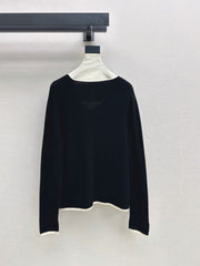 Black-and-white color-block V-neck knit top