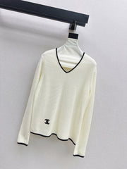 Black-and-white color-block V-neck knit top