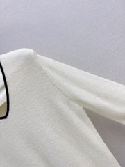 Black-and-white color-block V-neck knit top