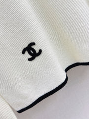 Black-and-white color-block V-neck knit top