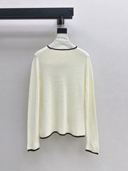 Black-and-white color-block V-neck knit top
